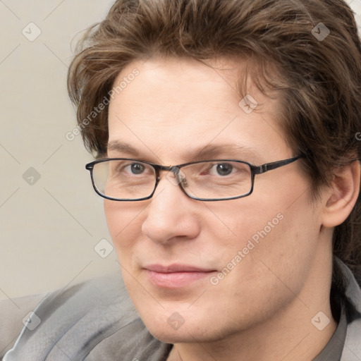 Joyful white adult male with short  brown hair and grey eyes