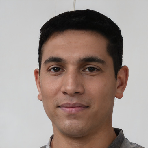Neutral latino young-adult male with short  black hair and brown eyes