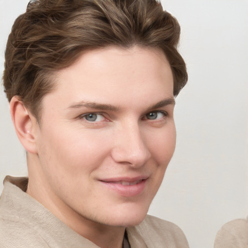 Joyful white young-adult female with short  brown hair and grey eyes