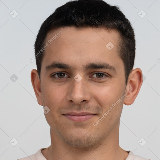 Joyful white young-adult male with short  brown hair and brown eyes