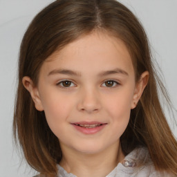 Joyful white child female with medium  brown hair and brown eyes