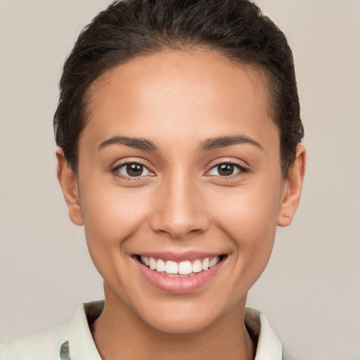 Joyful white young-adult female with short  brown hair and brown eyes