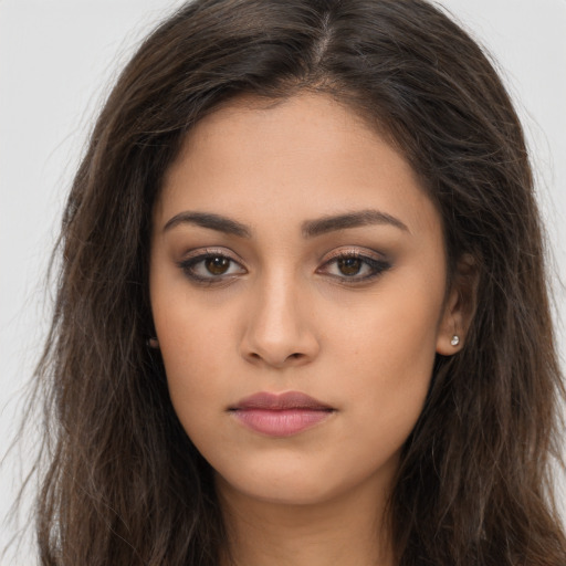Neutral white young-adult female with long  brown hair and brown eyes
