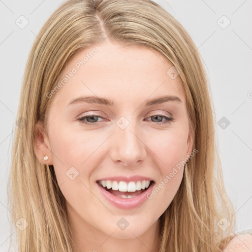 Joyful white young-adult female with long  brown hair and blue eyes