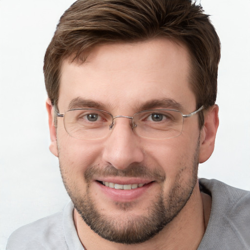 Joyful white adult male with short  brown hair and grey eyes