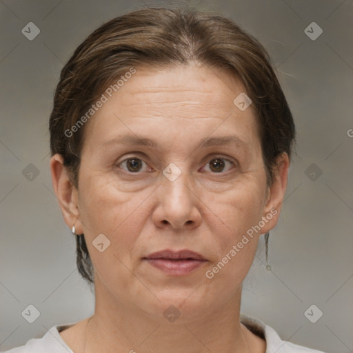 Joyful white adult female with short  brown hair and brown eyes