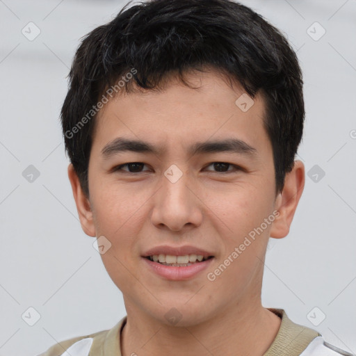 Joyful asian young-adult male with short  brown hair and brown eyes