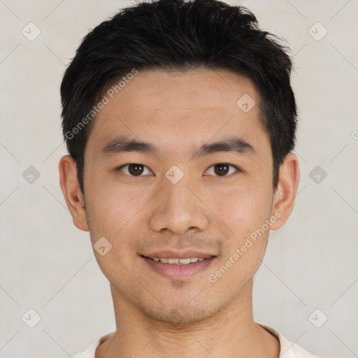 Joyful asian young-adult male with short  black hair and brown eyes