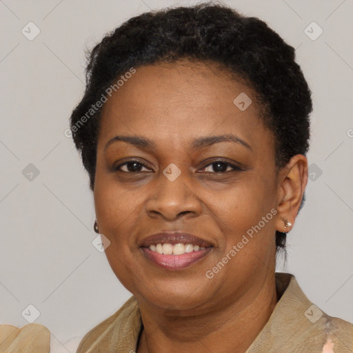 Joyful black adult female with short  brown hair and brown eyes