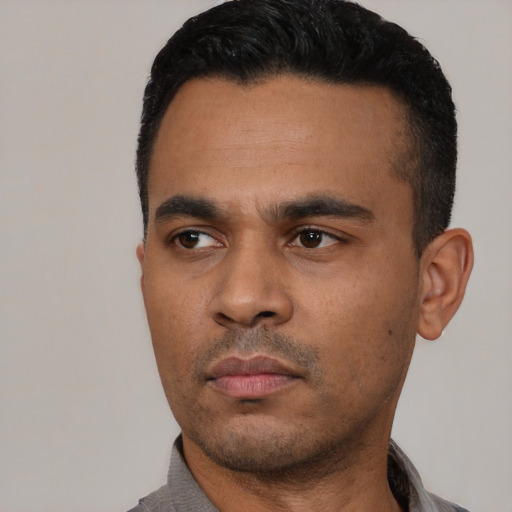 Neutral latino young-adult male with short  black hair and brown eyes