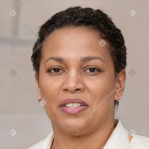 Joyful black adult female with short  brown hair and brown eyes