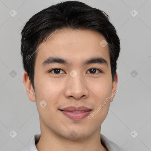 Joyful asian young-adult male with short  black hair and brown eyes