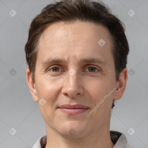 Joyful white adult male with short  brown hair and grey eyes