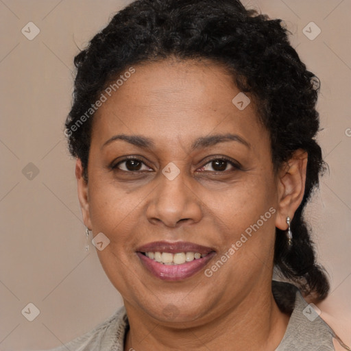 Joyful black adult female with short  brown hair and brown eyes