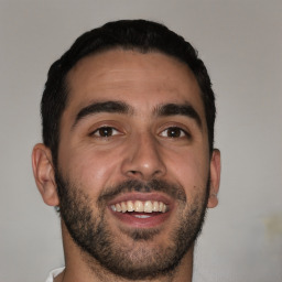 Joyful white young-adult male with short  black hair and brown eyes