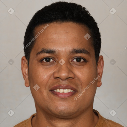 Joyful latino young-adult male with short  black hair and brown eyes