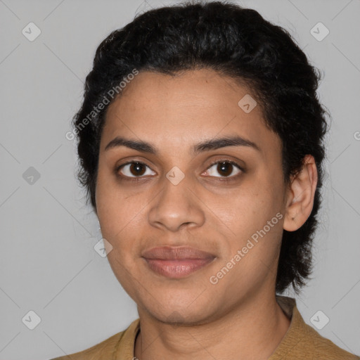 Joyful latino young-adult female with short  black hair and brown eyes