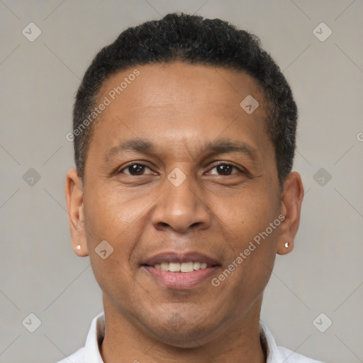Joyful latino adult male with short  brown hair and brown eyes