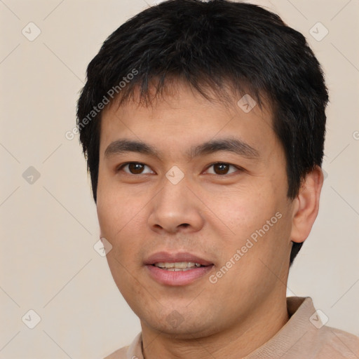 Joyful asian young-adult male with short  black hair and brown eyes