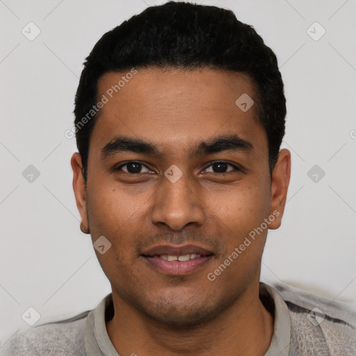 Joyful latino young-adult male with short  black hair and brown eyes