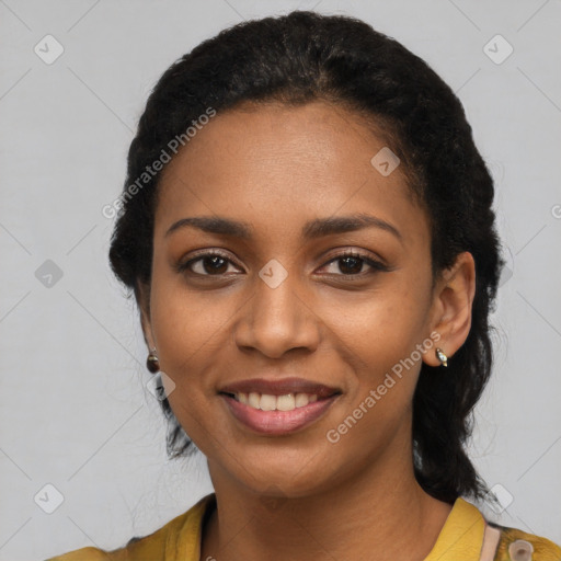 Joyful black young-adult female with long  black hair and brown eyes