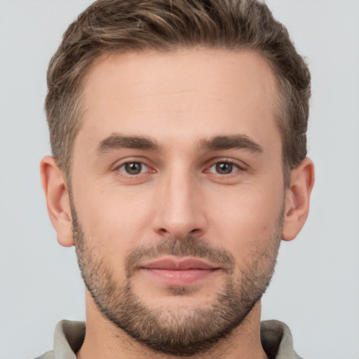 Joyful white young-adult male with short  brown hair and brown eyes