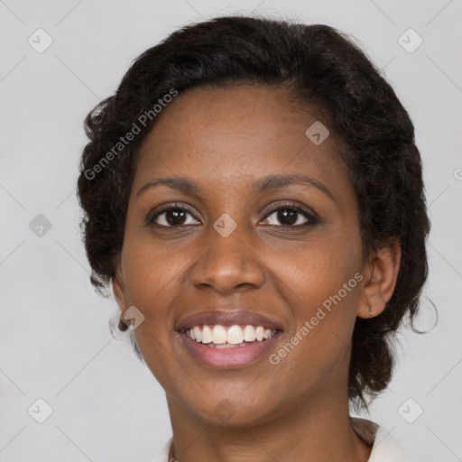 Joyful black young-adult female with medium  brown hair and brown eyes