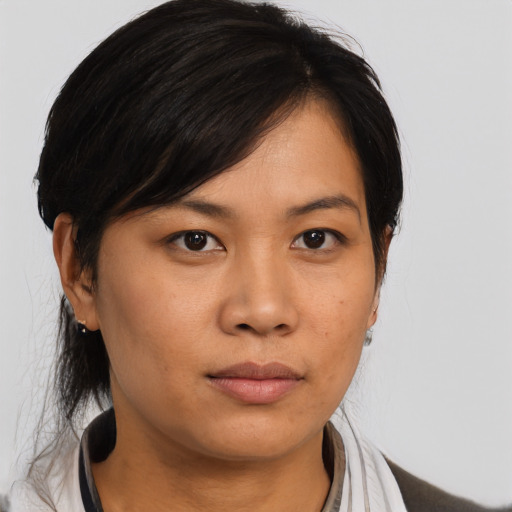 Neutral asian young-adult female with medium  black hair and brown eyes