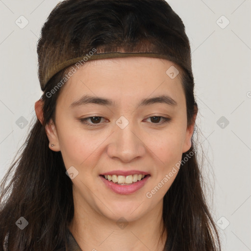 Joyful white young-adult female with long  brown hair and brown eyes