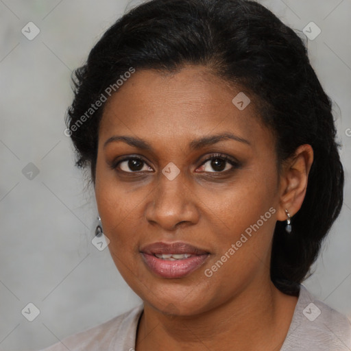 Joyful black adult female with medium  brown hair and brown eyes