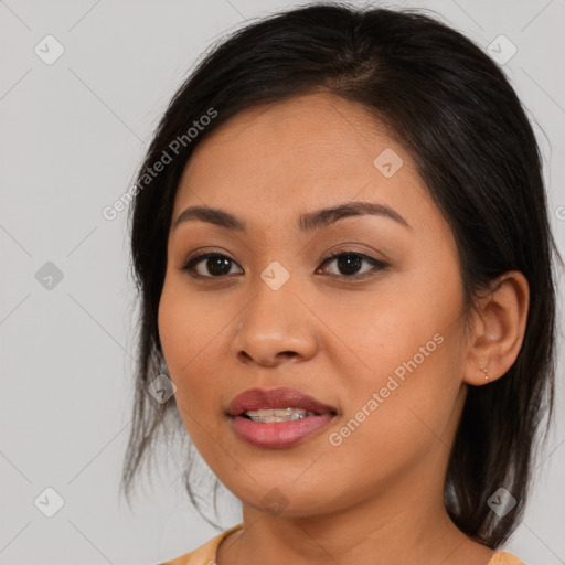 Joyful asian young-adult female with medium  brown hair and brown eyes