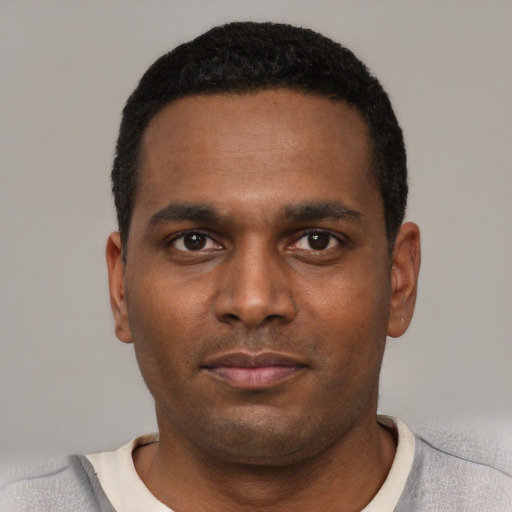 Neutral black young-adult male with short  black hair and brown eyes