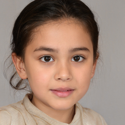 Joyful white child female with medium  brown hair and brown eyes