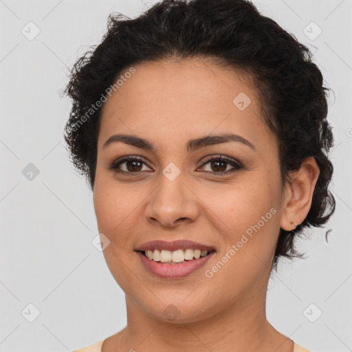 Joyful latino young-adult female with short  brown hair and brown eyes