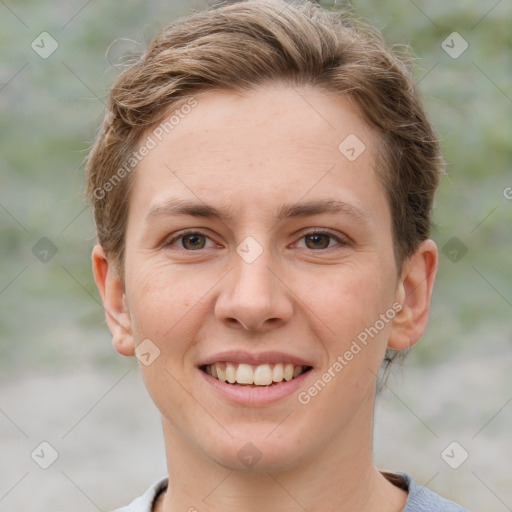 Joyful white young-adult female with short  brown hair and grey eyes