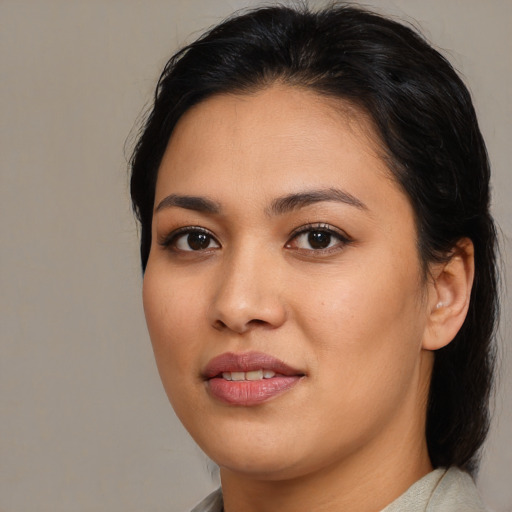 Joyful asian young-adult female with medium  brown hair and brown eyes