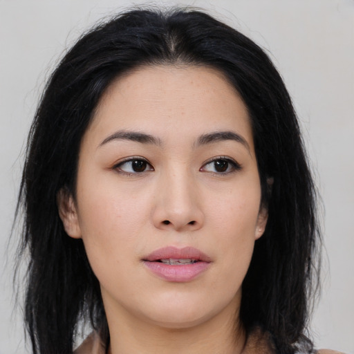 Joyful asian young-adult female with medium  black hair and brown eyes