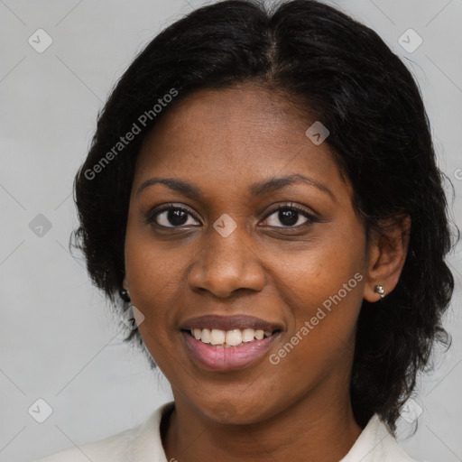 Joyful black adult female with medium  brown hair and brown eyes