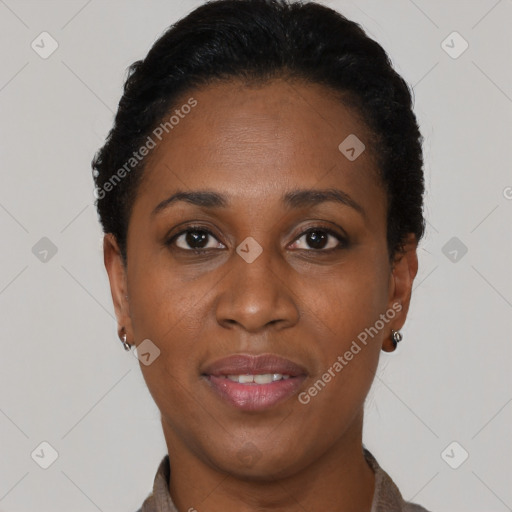 Joyful black young-adult female with short  black hair and brown eyes