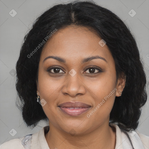 Joyful black adult female with medium  brown hair and brown eyes