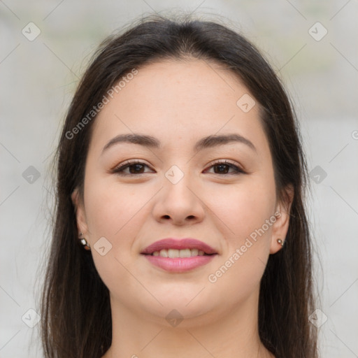 Joyful asian young-adult female with long  brown hair and brown eyes