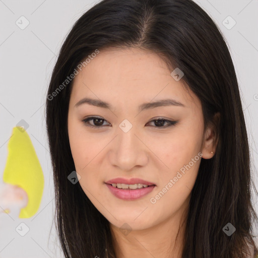 Joyful asian young-adult female with long  brown hair and brown eyes