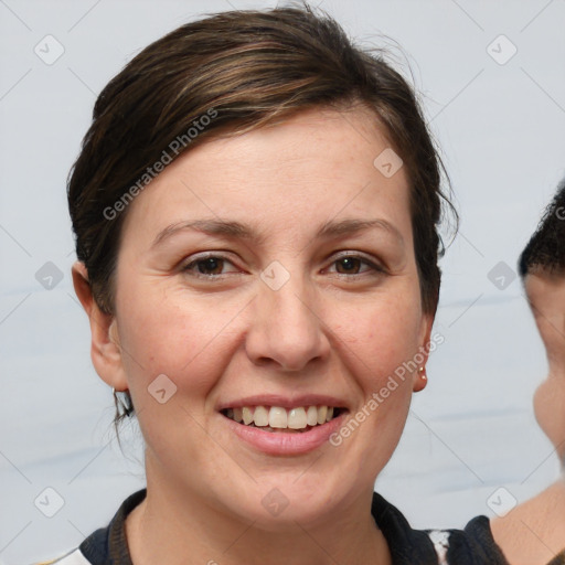 Joyful white adult female with medium  brown hair and brown eyes