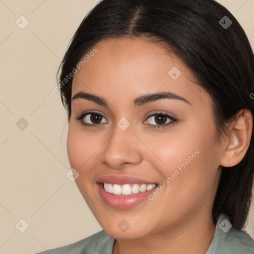 Joyful white young-adult female with long  brown hair and brown eyes