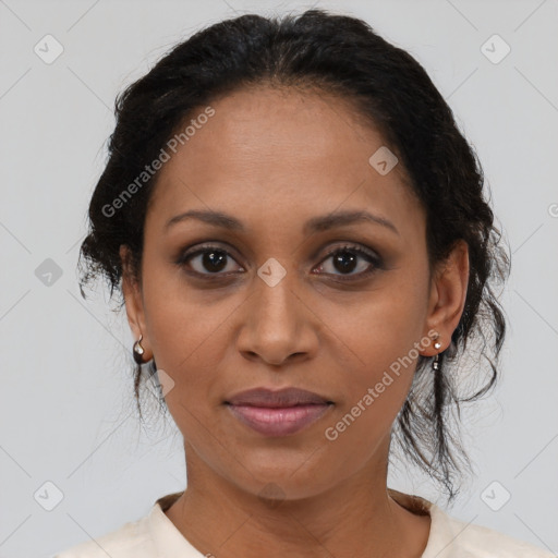 Joyful black adult female with medium  brown hair and brown eyes