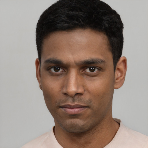 Neutral black young-adult male with short  black hair and brown eyes