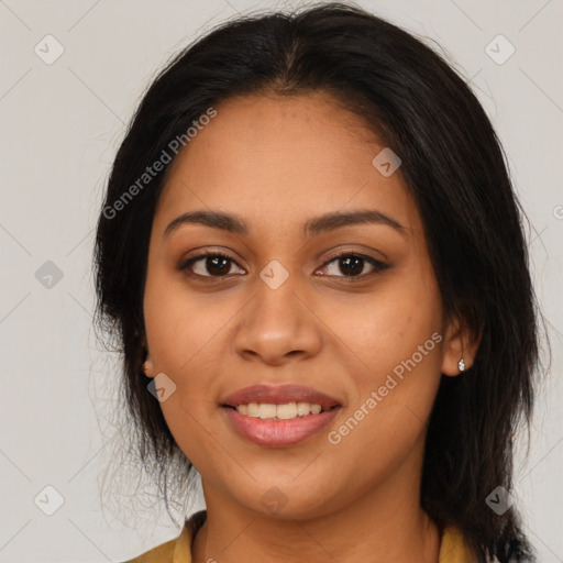 Joyful latino young-adult female with long  brown hair and brown eyes