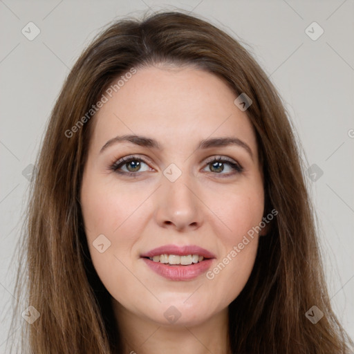 Joyful white young-adult female with long  brown hair and green eyes