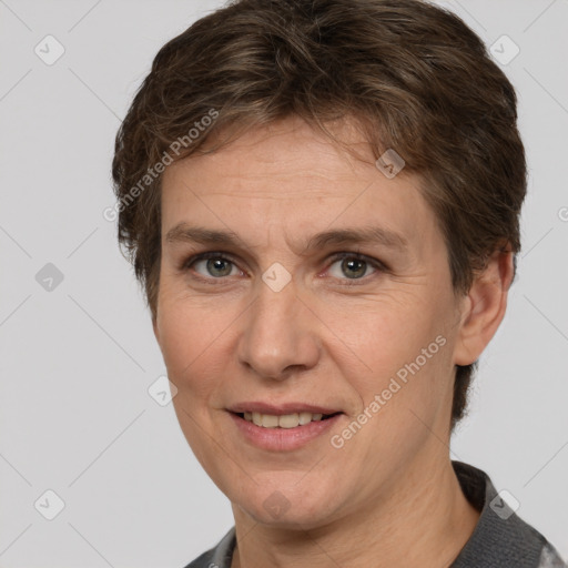 Joyful white adult female with short  brown hair and brown eyes