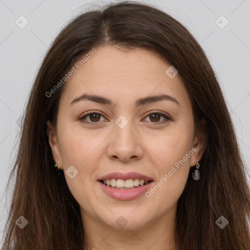 Joyful white young-adult female with long  brown hair and brown eyes